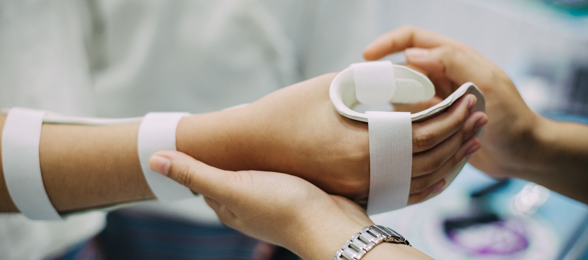 Certified hand therapist fitting a custom wrist splint